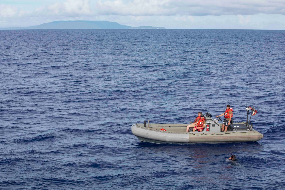 USS Ralph Johnson (DDG 114) Sailors enjoy swim call in the Philippine Sea, July 4
