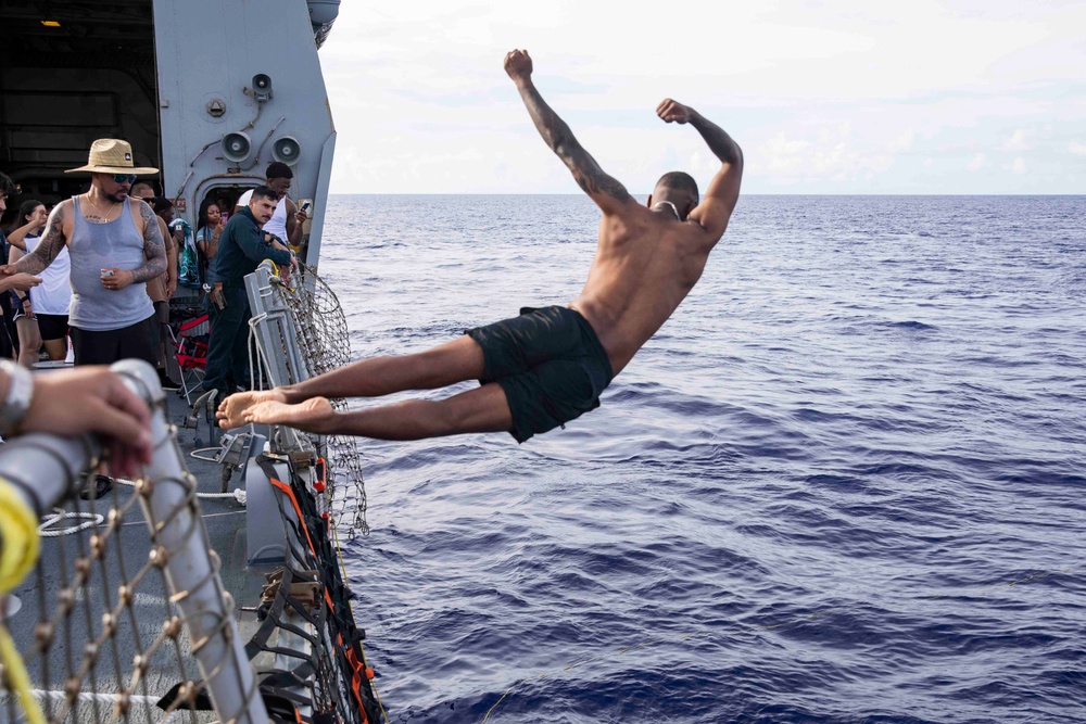 USS Ralph Johnson (DDG 114) Sailors enjoy swim call in the Philippine Sea, July 4