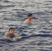 USS Ralph Johnson (DDG 114) Sailors enjoy swim call in the Philippine Sea, July 4