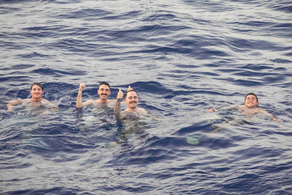 USS Ralph Johnson (DDG 114) Sailors enjoy swim call in the Philippine Sea, July 4