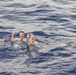 USS Ralph Johnson (DDG 114) Sailors enjoy swim call in the Philippine Sea, July 4