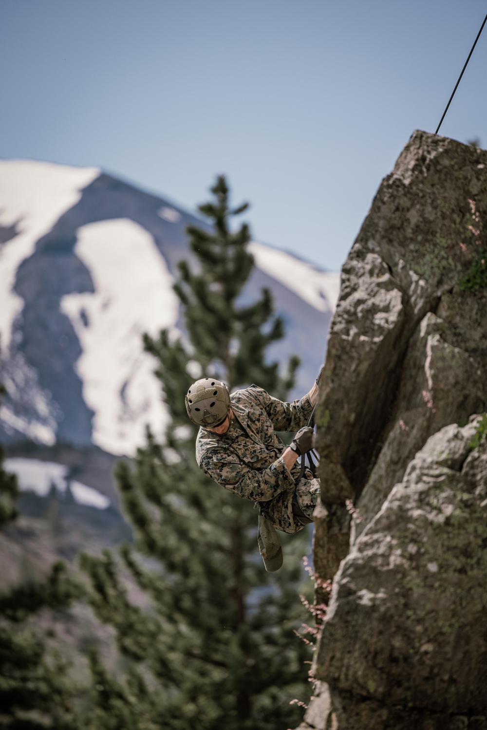 U.S. Marines with 4th Marine Division conduct ropes and rappelling training during Mountain Warfare Training Exercise 4-23