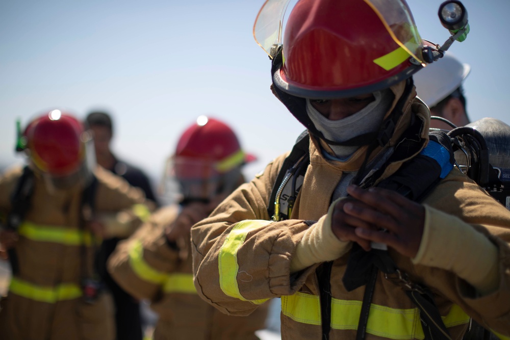 Midshipmen From U.S. Naval Academy Tour USS Tripoli