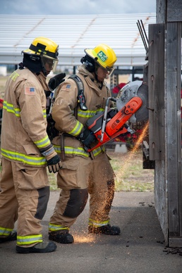 Firefighter recruits participate in firefighting drills