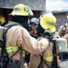 Firefighter recruits participate in firefighting drills