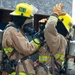 Firefighter recruits participate in firefighting drills