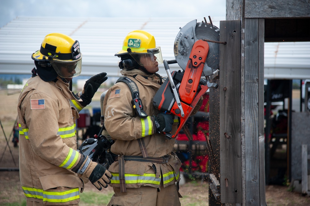 Firefighter recruits participate in firefighting drills