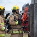 Firefighter recruits participate in firefighting drills