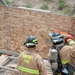 Firefighter recruits participate in firefighting drills