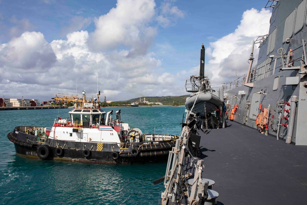 The USS Ralph Johnson (DDG 114) pulls into Guam.