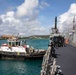 The USS Ralph Johnson (DDG 114) pulls into Guam.