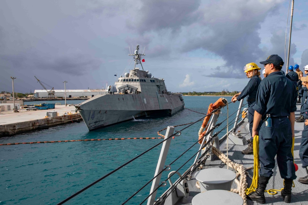 The USS Ralph Johnson (DDG 114) pulls into Guam.