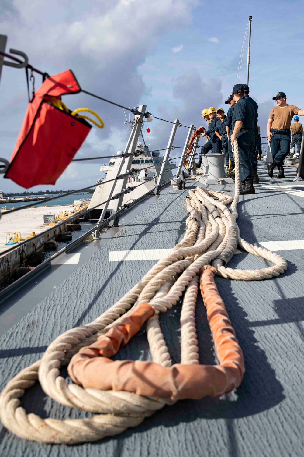 The USS Ralph Johnson (DDG 114) pulls into Guam.