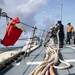 The USS Ralph Johnson (DDG 114) pulls into Guam.