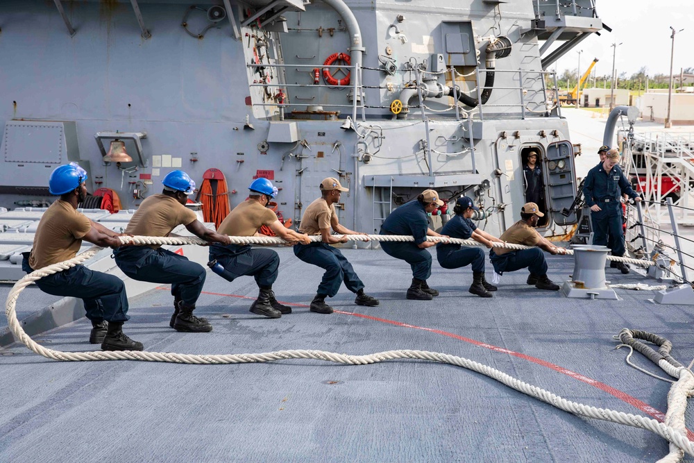 The USS Ralph Johnson (DDG 114) pulls into Guam.