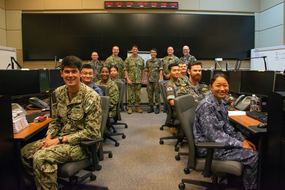 Service members from the Royal Australian Navy, Republic of Korea Navy and the U.S. Navy pose with their commanders during exercise Pacific Vanguard.