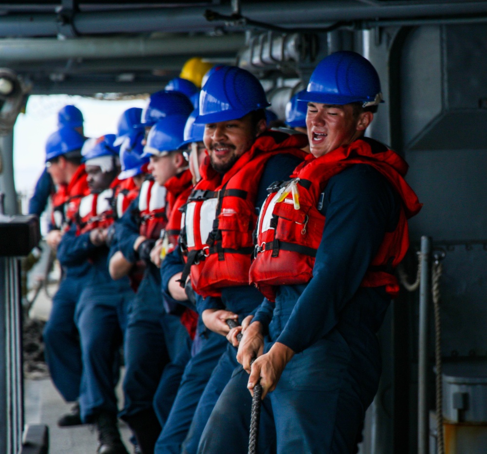 USS Robert Smalls (CG 62) Sailors Heave line during RAS