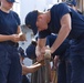 USCGA Cadet participates in work on deck