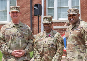 CSM Allen stands with BG Shirley and CSM Richardson after promotion to CSM