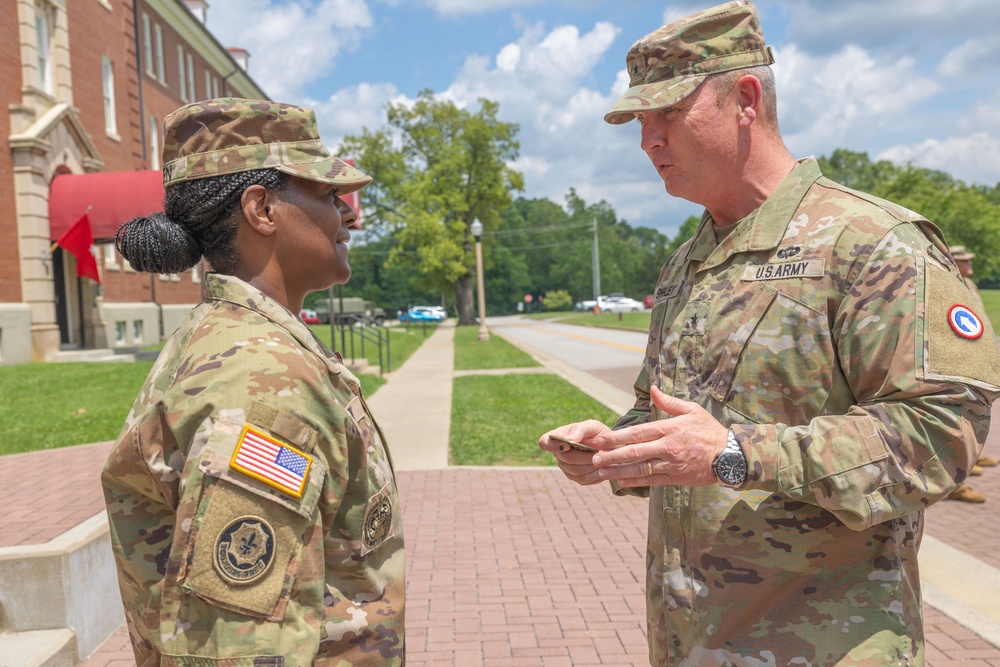 CSM Allen receives a command coin from BG Shirley