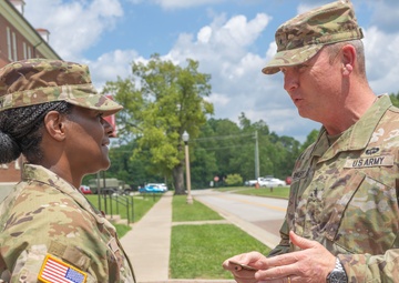 CSM Allen receives a command coin from BG Shirley
