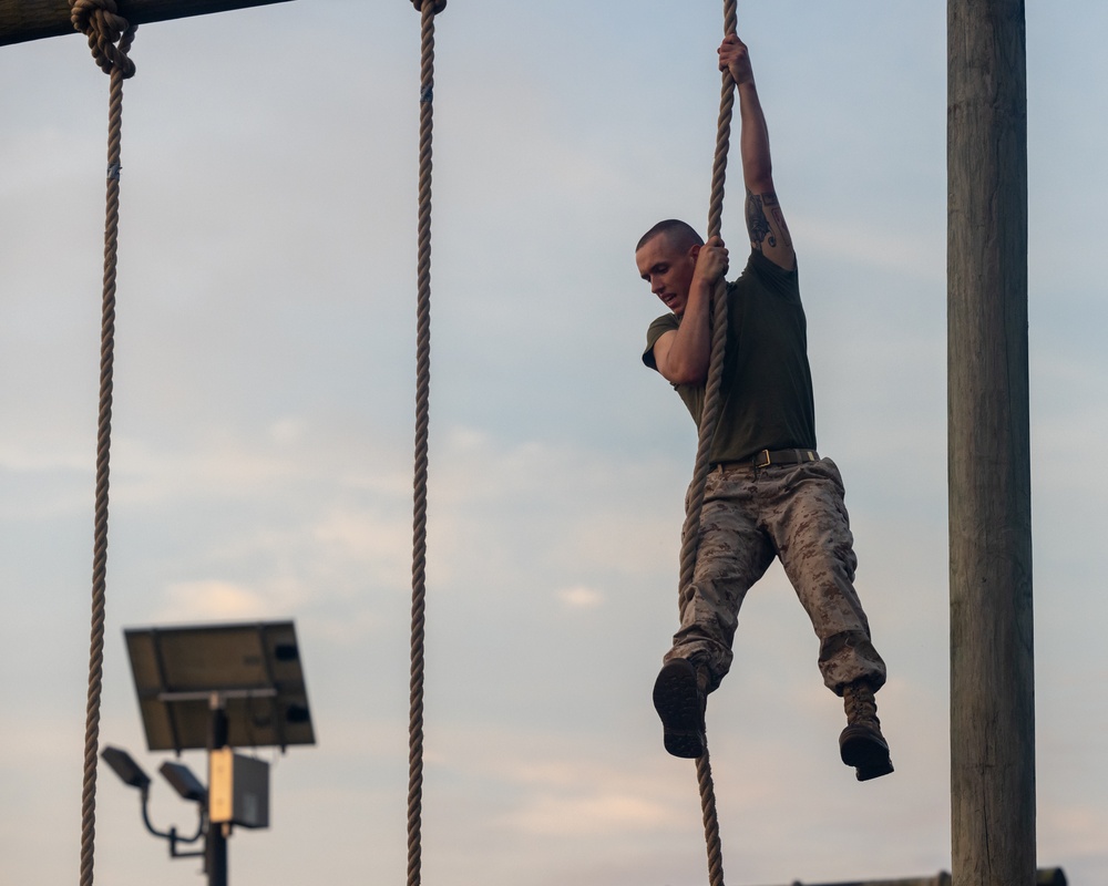 Officer Candidates compete in a timed obstacle course at the Officer Candidate School