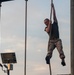 Officer Candidates compete in a timed obstacle course at the Officer Candidate School