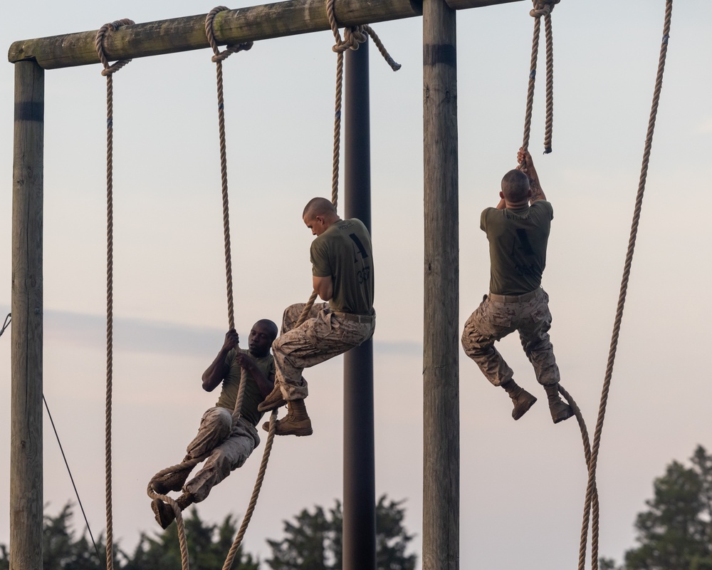 Officer Candidates compete in a timed obstacle course at the Officer Candidate School