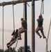 Officer Candidates compete in a timed obstacle course at the Officer Candidate School