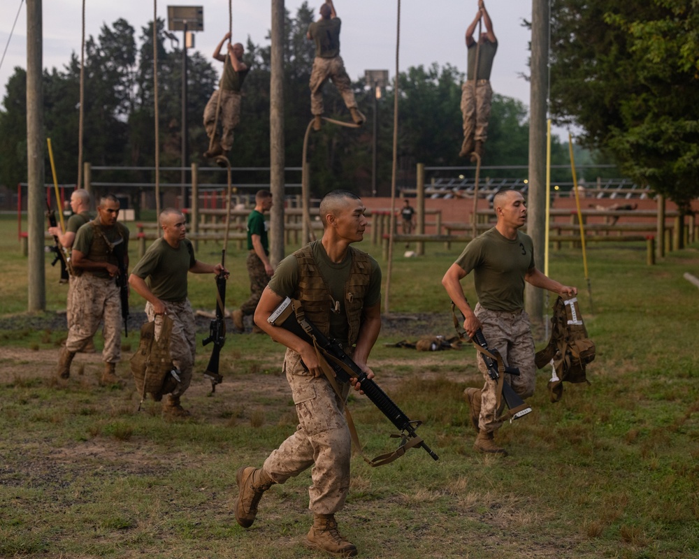 Officer Candidates compete in a timed obstacle course at the Officer Candidate School