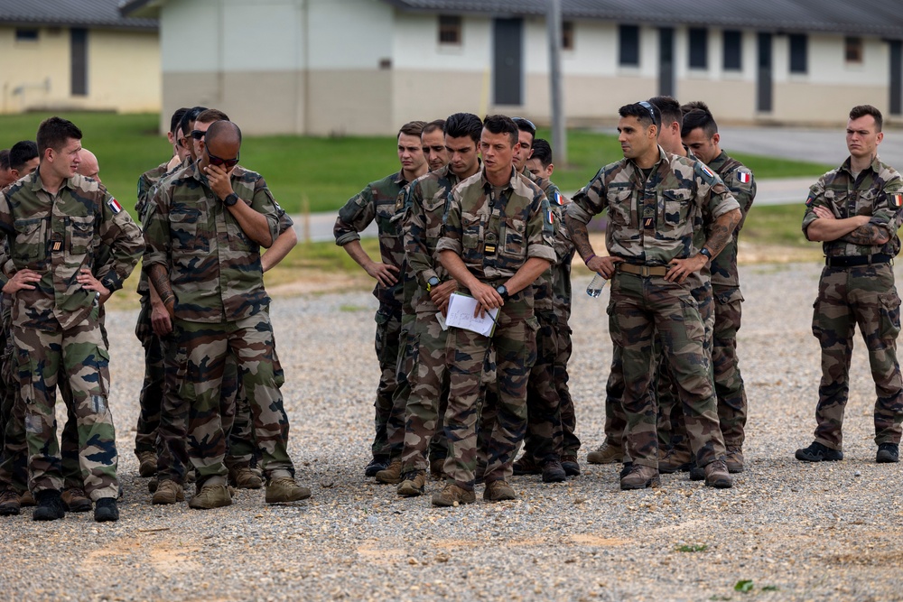 French soldiers conduct a direct action raid during Exercise Raven