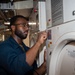 USS Ronald Reagan (CVN 76) Sailors provide laundry services