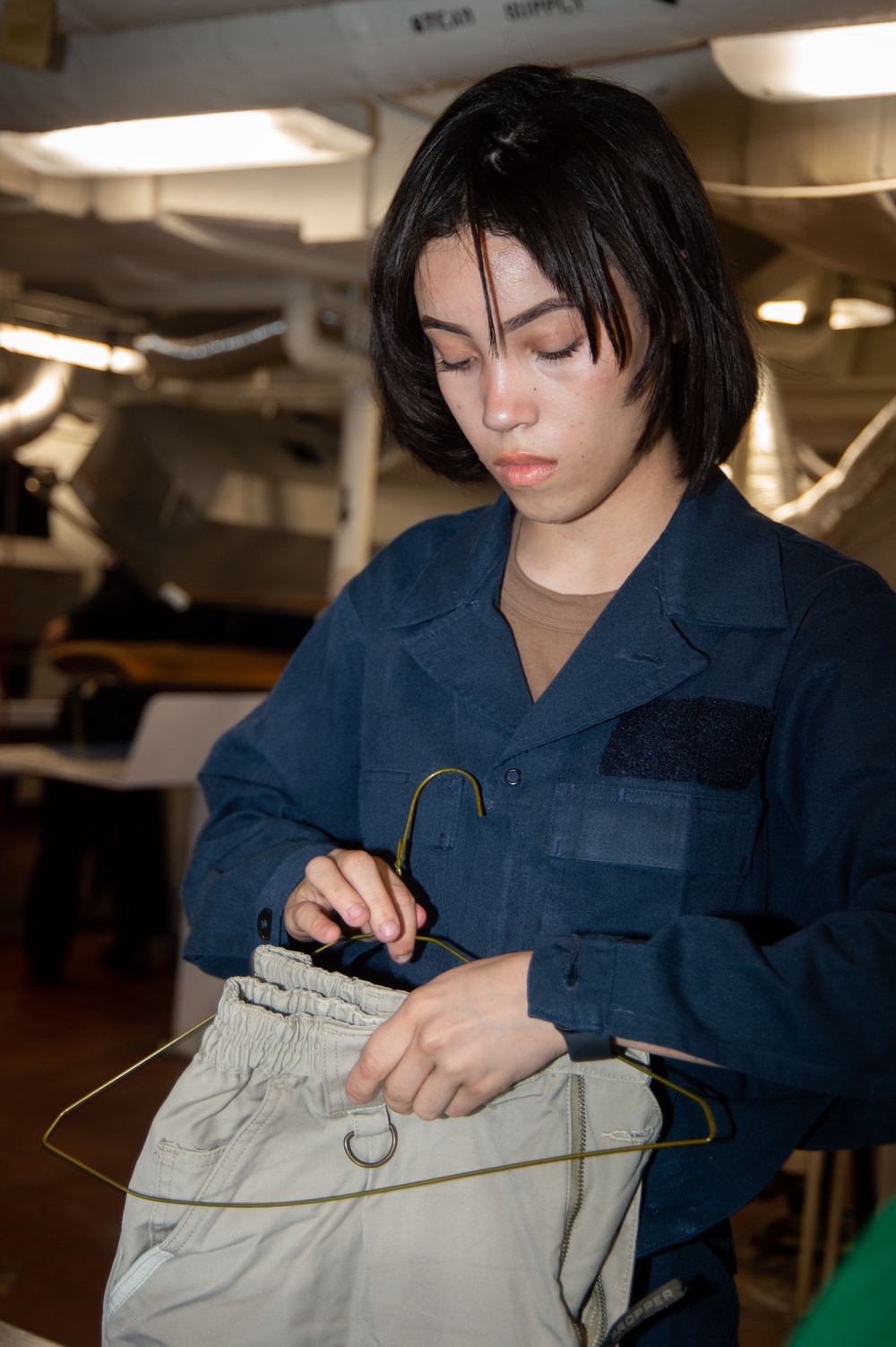 USS Ronald Reagan (CVN 76) Sailors provide laundry services