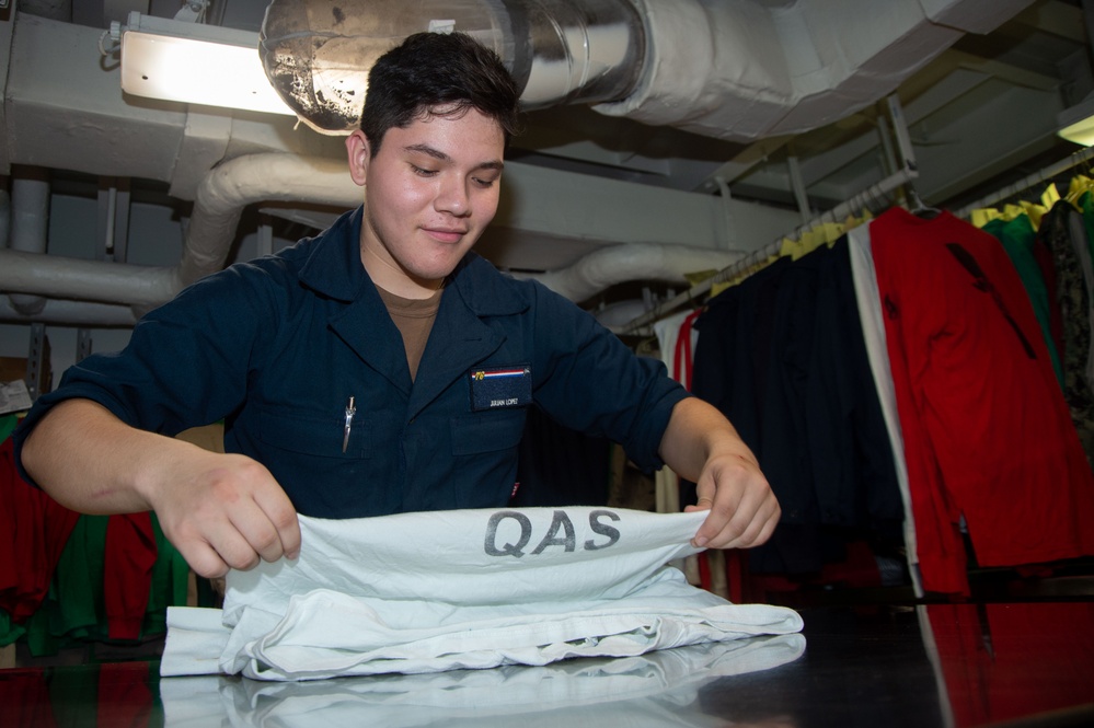 USS Ronald Reagan (CVN 76) Sailors provide laundry services