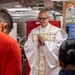 USS Rafael Peralta (DDG 115) holds a catholic service on the mess decks