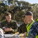 U.S. Marines and Australian Airmen load Missiles on Joint Strike Fighters together  