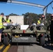 U.S. Marines and Australian Airmen load Missiles on Joint Strike Fighters together  