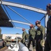 U.S. Marines and Australian Airmen load Missiles on Joint Strike Fighters together  