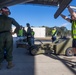 U.S. Marines and Australian Airmen load Missiles on Joint Strike Fighters together  