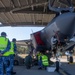 U.S. Marines and Australian Airmen load Missiles on Joint Strike Fighters together  