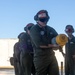 U.S. Marines and Australian Airmen load Missiles on Joint Strike Fighters together  