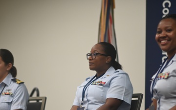 Coast Guard members conduct a panel discussion at the 2023 Joint Women's Leadership Symposium