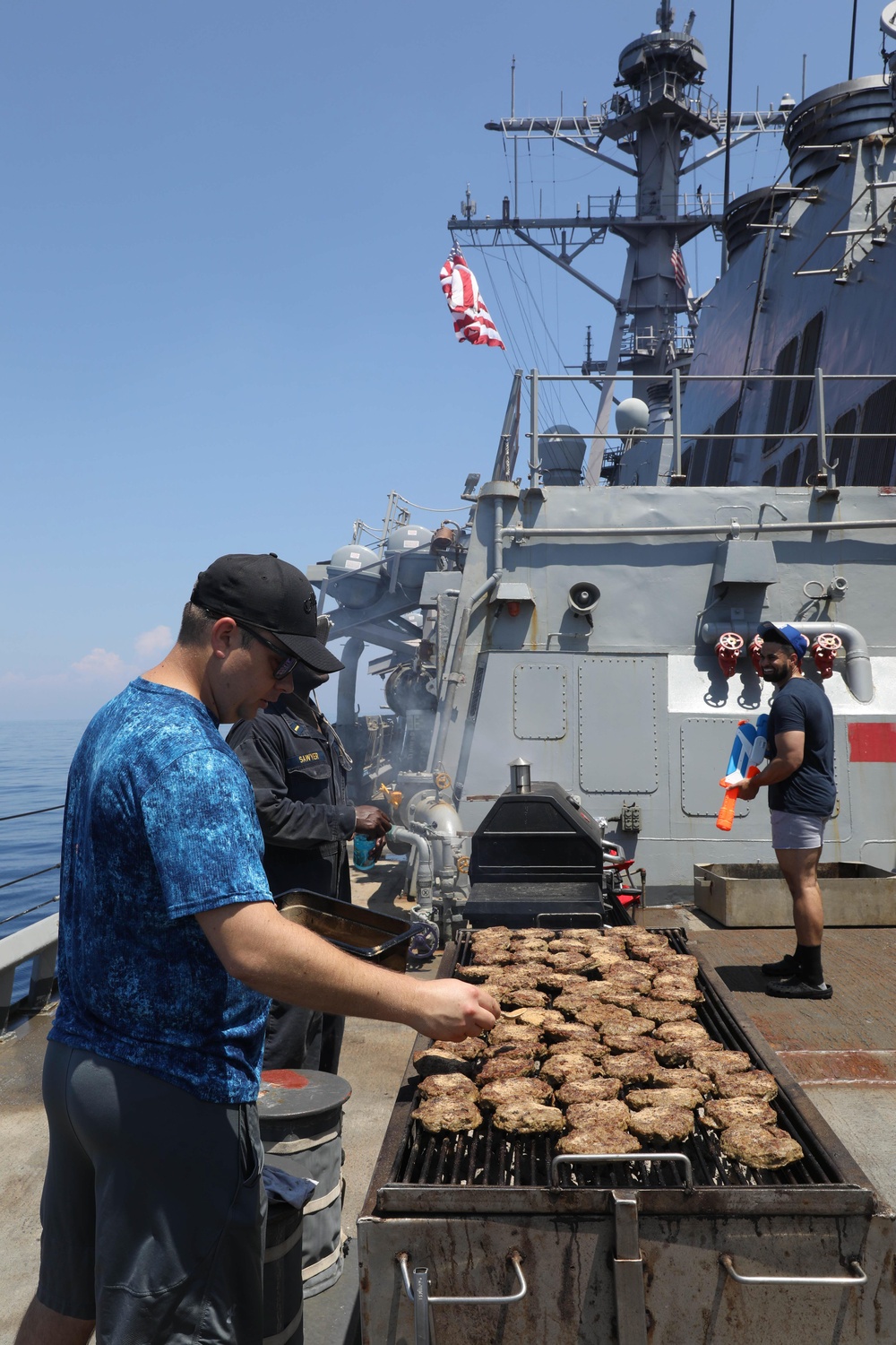 Sailor Cooks On Grill