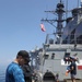 Sailor Cooks On Grill