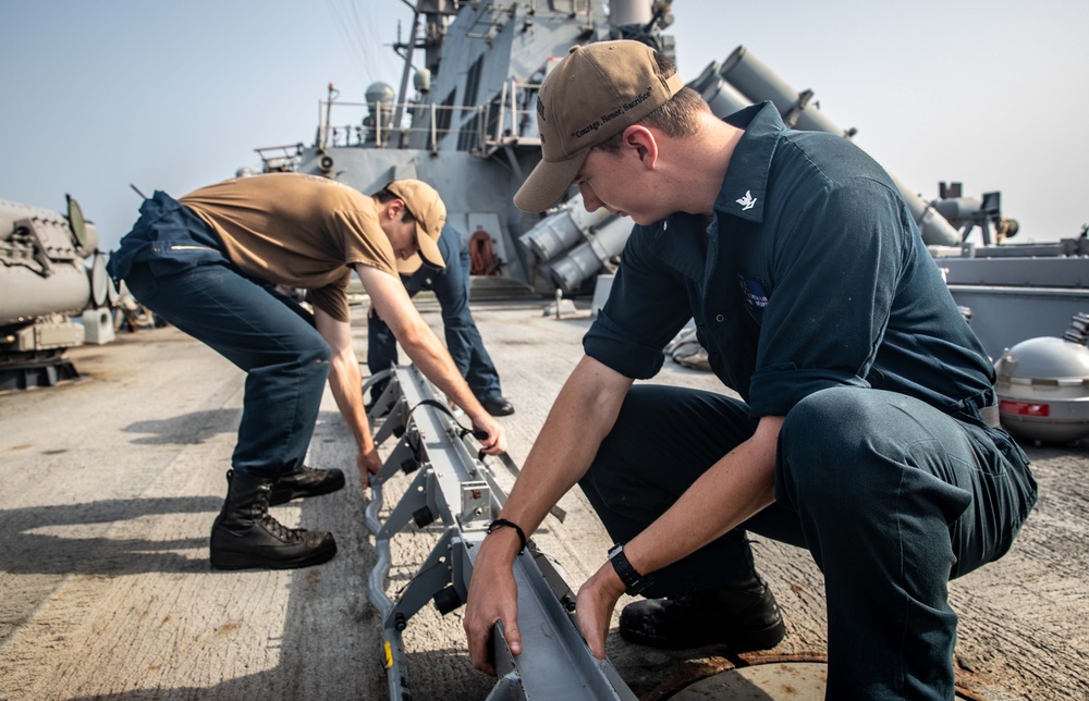 USS McFaul Sailors Perform Maintenance