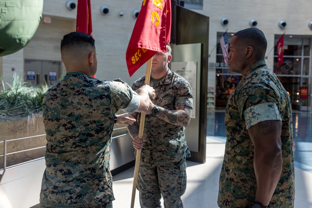 U.S. Marine Corps Capt. Connor McNamara relieves Capt. Moses Menchaca, outgoing company commander during Headquarters Company Change of Command Ceremony at the National Museum of the Marine Corps