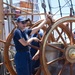 USCGA Cadet at USCGC Eagle's helm