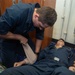 Lt. j.g. Knauss Applies Bandage to ET2 Creedy as he Simulates a Patient