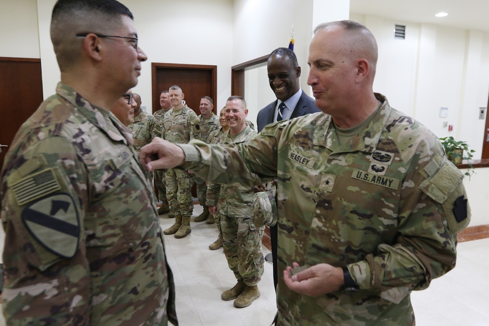 Task Force Liberty Soldiers promote, re-enlist at Qatar embassy ceremony