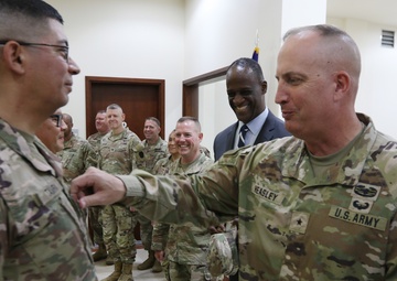 Task Force Liberty Soldiers promote, re-enlist at Qatar embassy ceremony